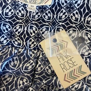 Women's XS, NWT's, blue and cream with pink and teal accents on the bottom